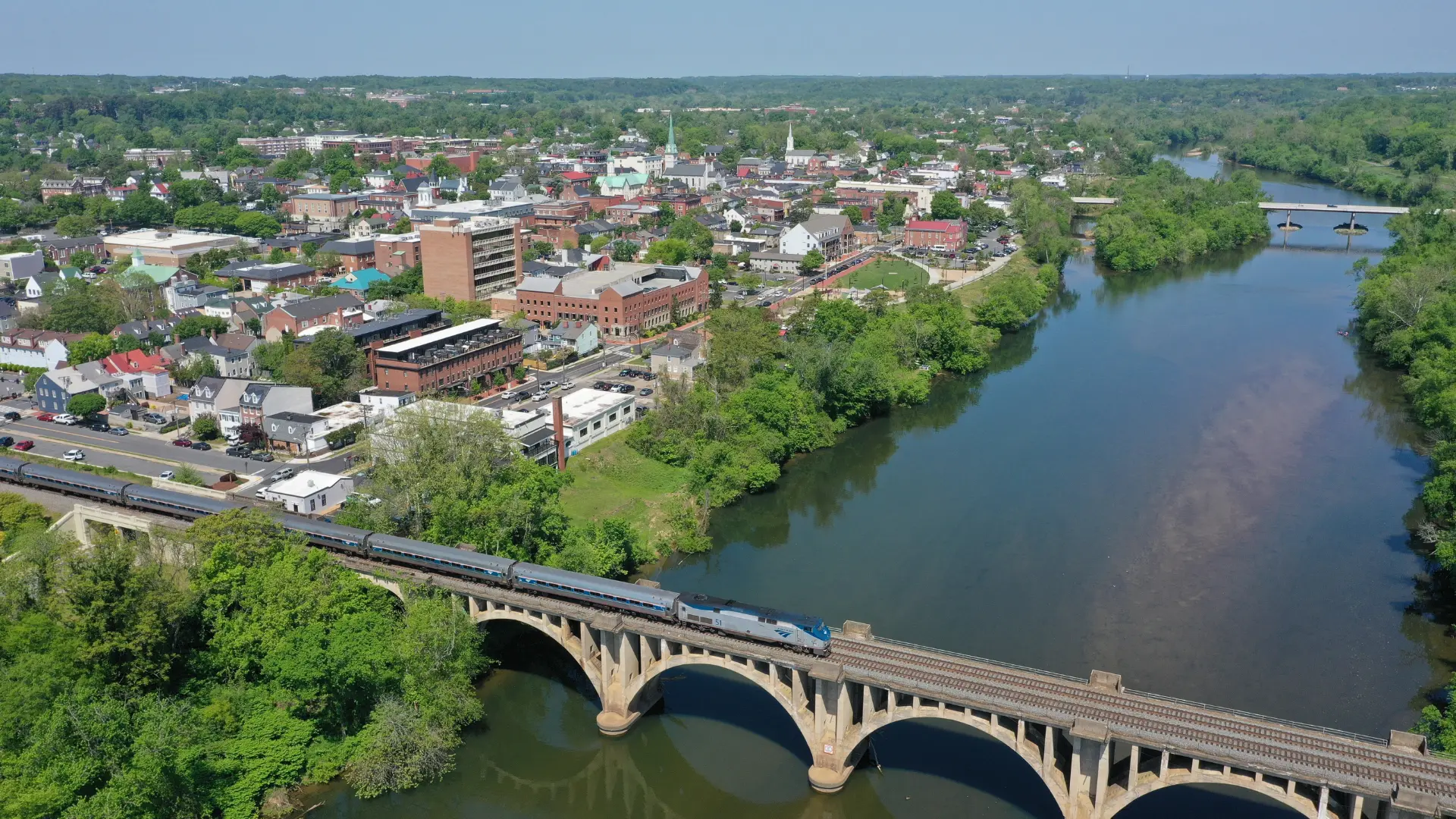 Amtrak train on a train bridge across the Rappahannock River in Fredericksburg